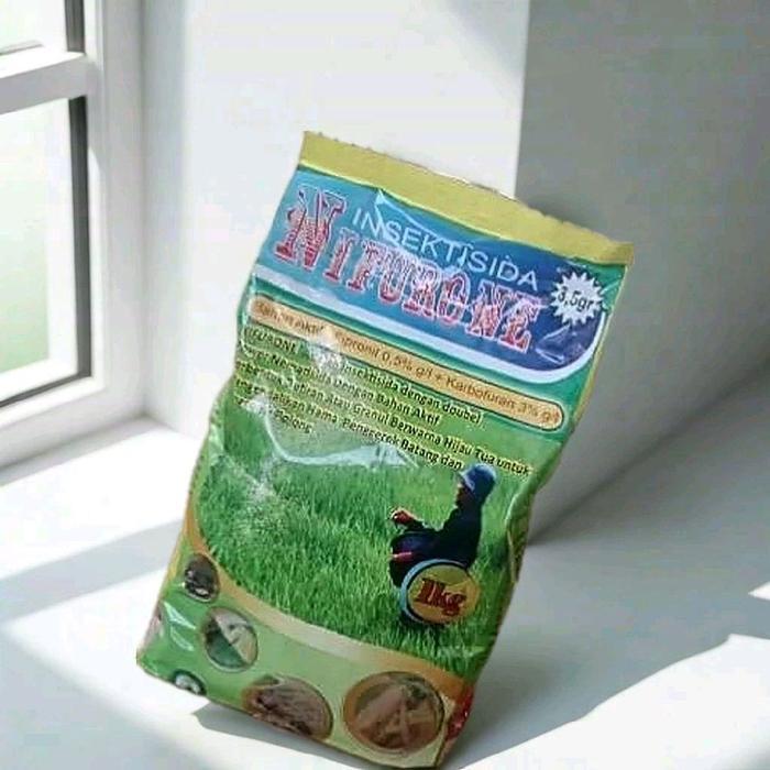 ` Insektisida tabur NIFURONE 3,5 gr. Bahan aktif: Fipronil 0,5 g/l dan karbofuran 3 g/l.kemasan 1kg.