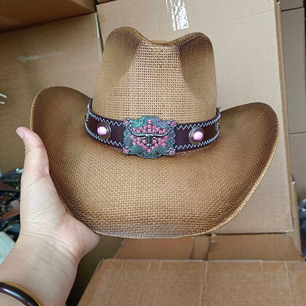 Red western cowboy hat featuring a brown hat band adorned with a studs and pendant Long-horned Ox