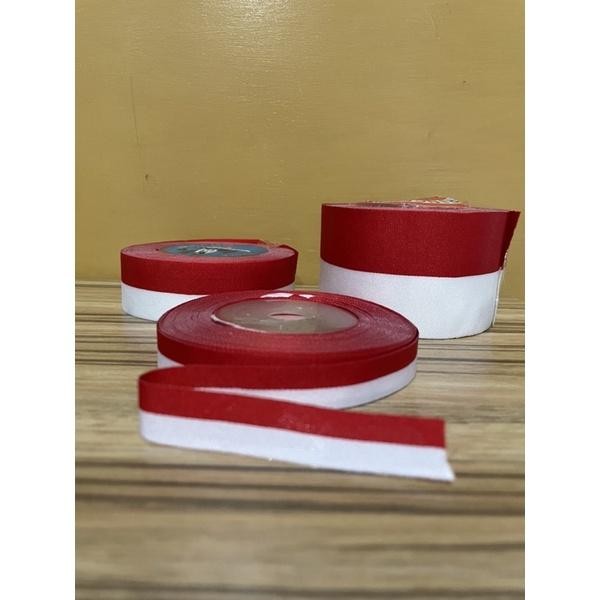 Pita merah putih per roll ( 20 yard)