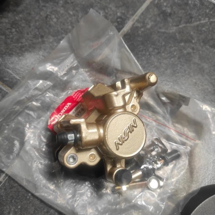 PALA BABI BELAKANG KALIPER REM SUPRA X 125 BLADE NEW 125 ORI NISSIN