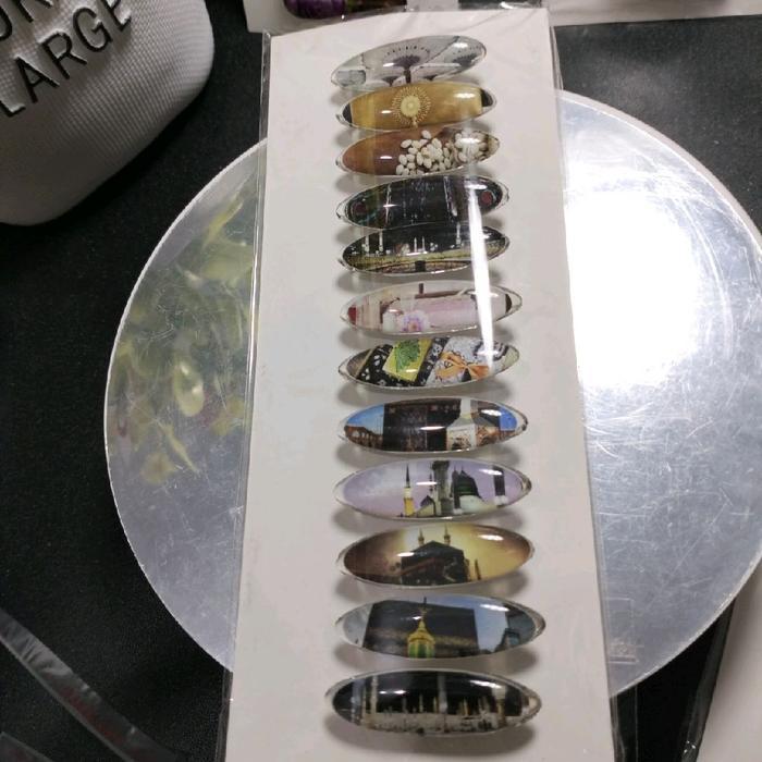 Peniti Jilbab Dagu lusinan Motif Mekah oval /kapsul pengganti jarum pentul