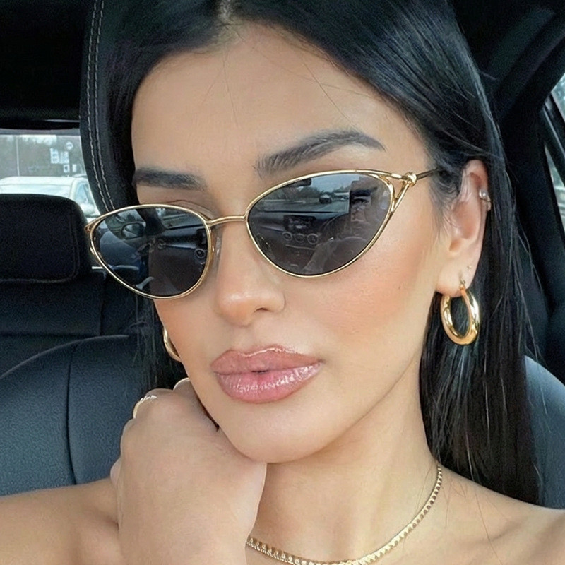 Small frame cat-eye metal sunglasses in a vintage knot design, featuring a bold and edgy look