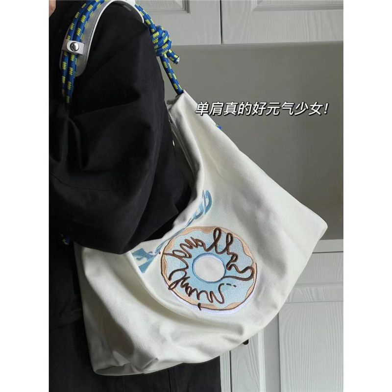 Sera all-match Jepang niche merek trendi baru bertekstur kanvas berkapasitas besar tote bag fashion bordir tas bahu tas ketiak