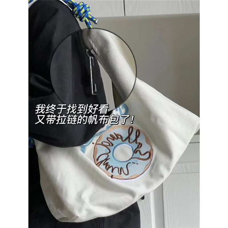 Sera all-match Jepang niche merek trendi baru bertekstur kanvas berkapasitas besar tote bag fashion bordir tas bahu tas ketiak