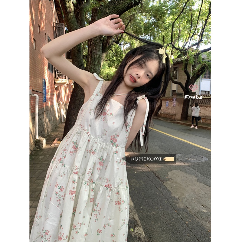 Red Angin sepoi-sepoi dan rok bermotif bunga manis pinggang wanita rok suspender ramping desain musim panas masuk akal gaun mid-length ceruk