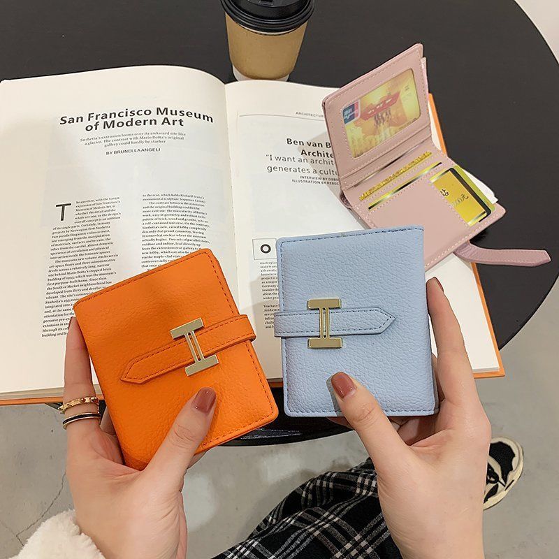 Sera dompet wanita 2023 baru ringan dan tipis 20% off net red short wallet niche siswa pendek high-end sense card tas wanita